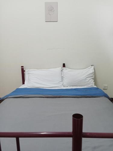 Ένα ή περισσότερα κρεβάτια σε δωμάτιο στο Seri Bulan Condo