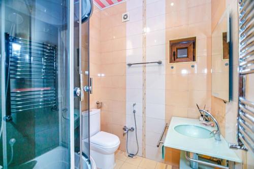 a bathroom with a toilet and a sink and a shower at Luxury Villa with Breakfast in Baku