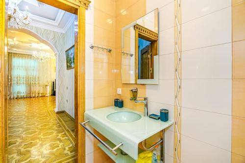 a bathroom with a sink and a mirror at Luxury Villa with Breakfast in Baku