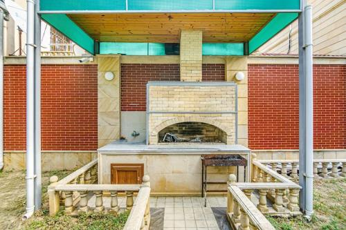 a patio with a brick oven in a house at Luxury Villa with Breakfast in Baku