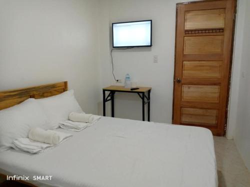 Postel nebo postele na pokoji v ubytování TD ROOMSTAY