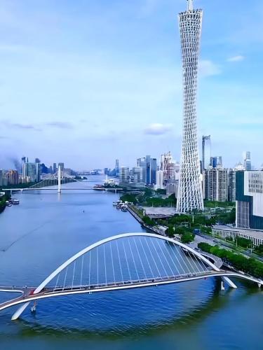 a rendering of a bridge with a city in the background at Magnolia Loft Downtown Guangzhou - Canton Fair Free Shuttle in Guangzhou