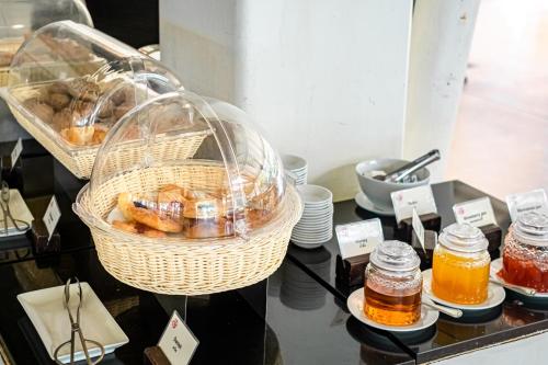 a display case with baskets of honey and other items at Aonang Villa Resort l Lifestyle Beachfront Resort in Ao Nang Beach