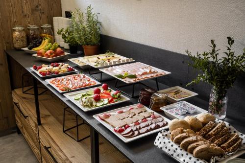 a buffet line with many different types of food at Owce Dwie in Zakopane