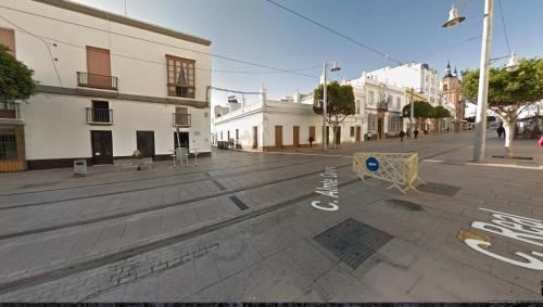 an empty street with writing on the street at Casa Cervera in San Fernando