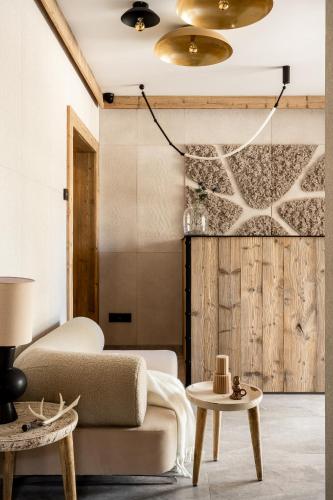 a living room with a couch and a table at Owce Dwie in Zakopane