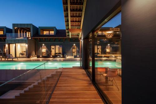 a view of a swimming pool from a house at VINEHO in Barolo