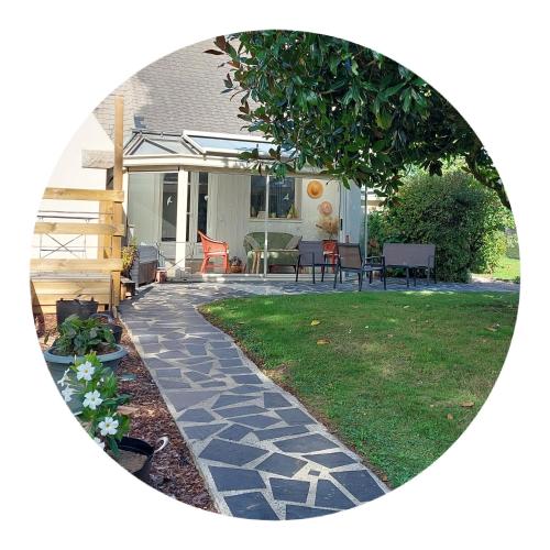 a circular picture of a yard with a stone walkway at La Cressonnière 56 in Missiriac