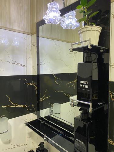 a coffee machine in a room with a light at Alone Cage Ella in Ella