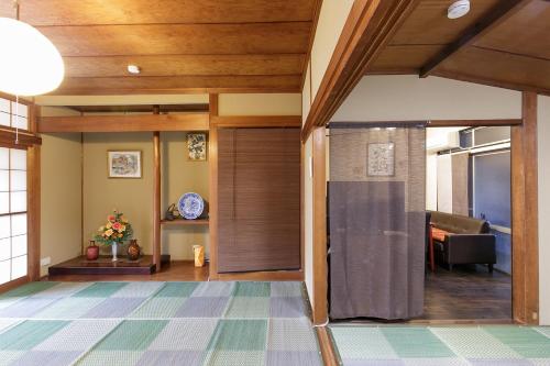 a hallway with a sliding door in a house at -W- Vacation Rental in Nagoya