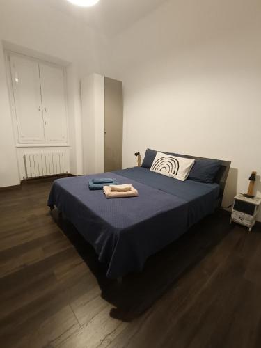 a bedroom with a bed with two towels on it at GTapartment in Rome