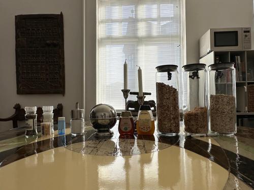 a counter top with many different items on it at Bed and Breakfast The Old Chestnut Tree Silkeborg in Silkeborg