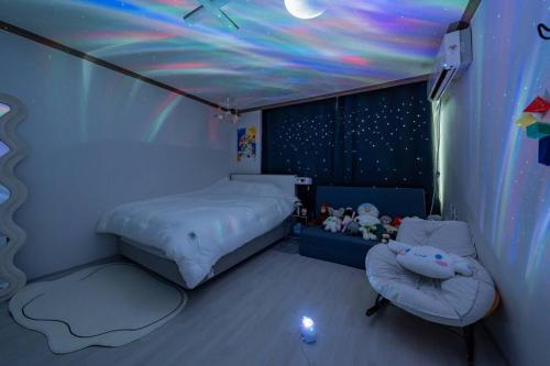 a bedroom with a bed and a star ceiling at Anime House in Daejeon
