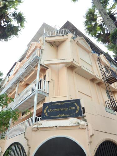 a building with a sign that reads recovery inn at Boomerang Inn in Patong Beach