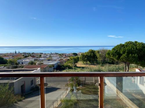 a view of the ocean from the balcony of a house at Nora's Flats in Triscina