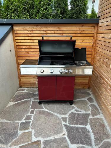 a barbecue grill sitting on a stone patio at Hotel Hochfirst in Lenzkirch