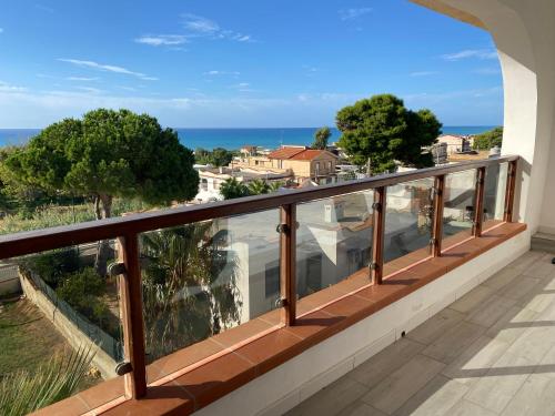 a balcony with a view of the ocean at Nora's Flats in Triscina
