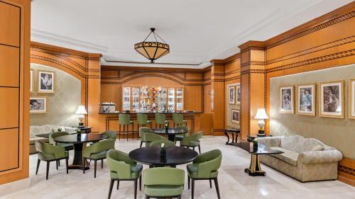 a restaurant with tables and chairs in a room at Swissôtel Sharm El Sheikh - Ultra All Inclusive Collection in Sharm El Sheikh