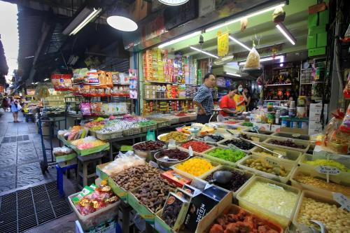 a market with a variety of fruits and vegetables at xx HD Yaowarat Road BKK in Samphanthawong