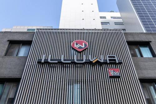 a building with a bmw sign on the side of it at illuwa M in Seoul