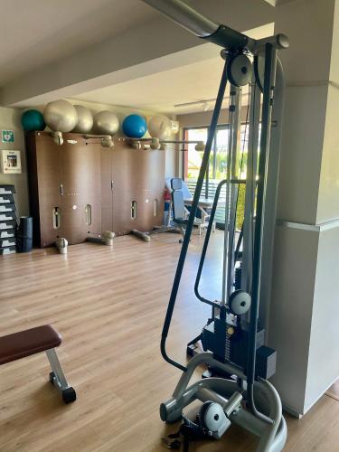 a room with a gym with a treadmill at Mansarda Relax Wellness Gym & Spa in Taormina