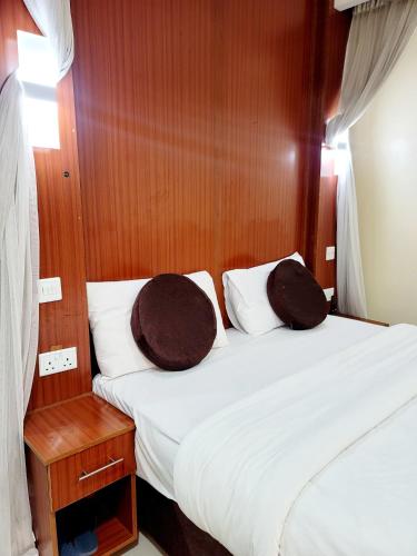 Ένα ή περισσότερα κρεβάτια σε δωμάτιο στο Nairobi Glory Palace Hotel