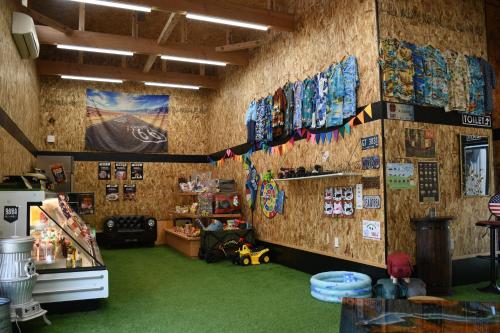 a room with a wall with flags on it at Win Village in Sasebo