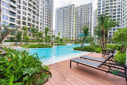 a swimming pool in a city with tall buildings at Masteri Centre Point - Vihomes serviced apartment in Long Bình