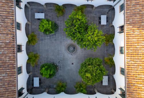 an aerial view of a brick wall with trees on it at La Almoraima Hotel in Castellar de la Frontera