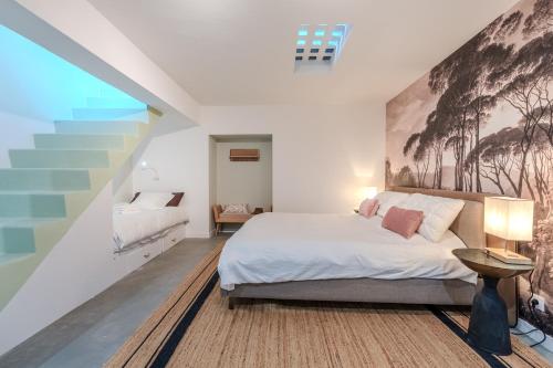 Ένα ή περισσότερα κρεβάτια σε δωμάτιο στο Chambre d'hôte dans un loft cosy en cœur de ville