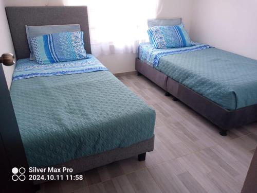 Кровать или кровати в номере Casa Vacacional en Carmen de Apicala, Colombia