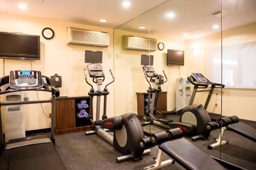 a gym with several exercise equipment in a room at Fairfield Inn & Suites Fredericksburg in Fredericksburg