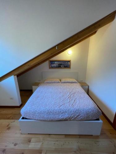 a bedroom with a bed in a attic at Nest in Alagna in Alagna Valsesia