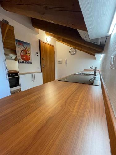 a kitchen with a wooden counter top in a room at Nest in Alagna in Alagna Valsesia