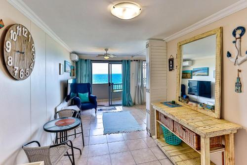 a living room with a view of the ocean at Blue Largo 6 in Westbrook