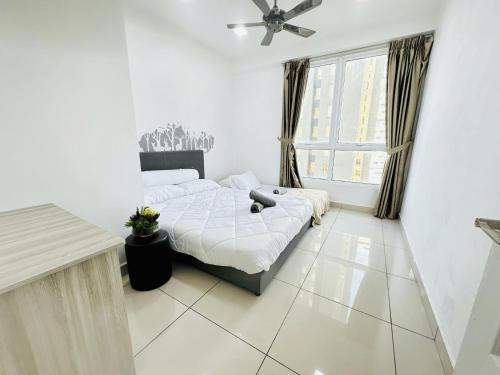 a bedroom with two beds and a ceiling fan at 10pax 3-Bedroom l Seaview l Georgetown l Gleneagles l Mansion One in George Town