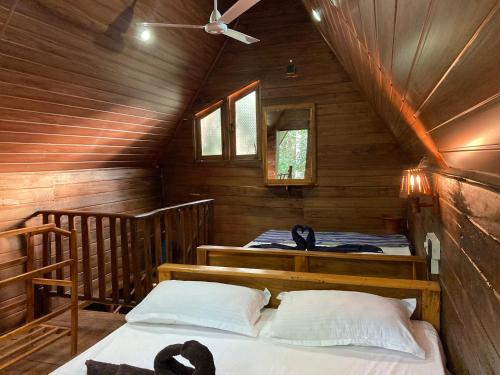 Postel nebo postele na pokoji v ubytování Sigiri Lodge Tree House