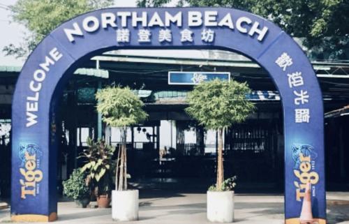 an entrance to a northmanent beach sign with trees at 10pax 3-Bedroom l Seaview l Georgetown l Gleneagles l Mansion One in George Town