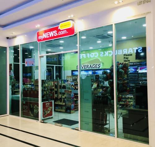 a store front of a store with glass doors at 10pax 3-Bedroom l Seaview l Georgetown l Gleneagles l Mansion One in George Town