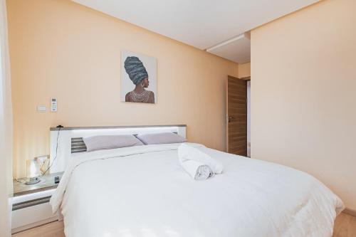 Postel nebo postele na pokoji v ubytování Migdal Gueliz Apart Hôtel