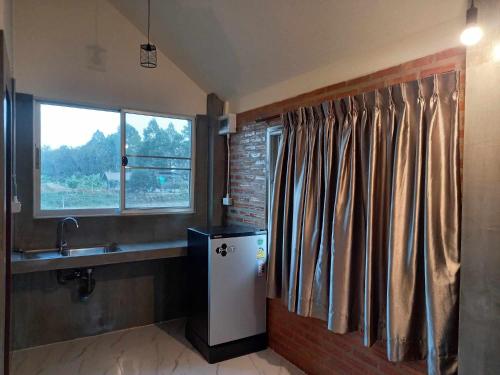 Kuchyň nebo kuchyňský kout v ubytování MatanaCafe&Resort