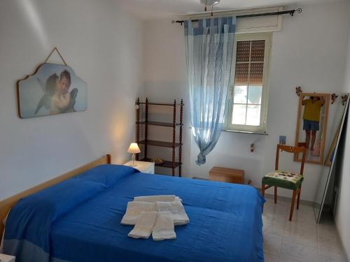 Postel nebo postele na pokoji v ubytování Il cappero, sul mare