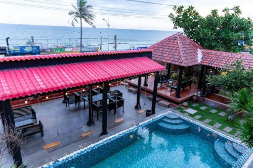 an aerial view of a resort with a swimming pool at Sabina Boutique Hotel & Villa Mui Ne in Mui Ne