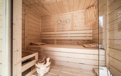 a sauna with a bench in a wooden cabin at Ô songes de Saxel in Saxel