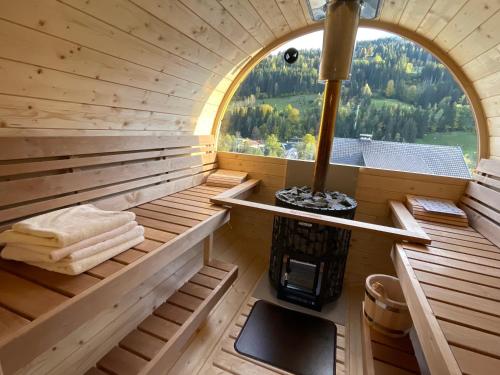 an inside view of a sauna with a stove at Sun Chalet in Schladming
