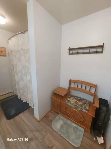 a small room with a bed and a room with at Hunter's Haven in Haines