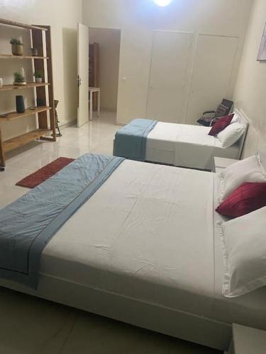 Postel nebo postele na pokoji v ubytování Appartement F2 Cosy Dakar Plateau
