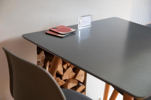 a table with a book sitting on top of it at Stylish one bed apartment in the Stroud Valleys in Brimscombe