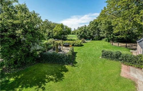 an overhead view of a garden with trees and grass at Nice Home In Spjald With 6 Bedrooms in Videbæk