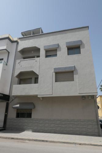 a building on the side of a street at Les portes de Temara in Temara